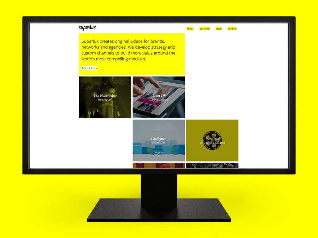 The Superlux agency portfolio website on a desktop monitor. (Web Development)