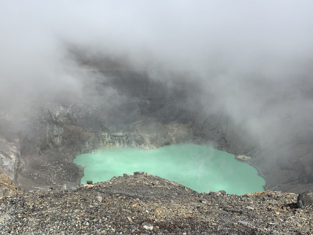 Photo of clouds clearing from volcano crater